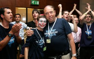 Professor Or with a young cancer patient at zichron menachem party